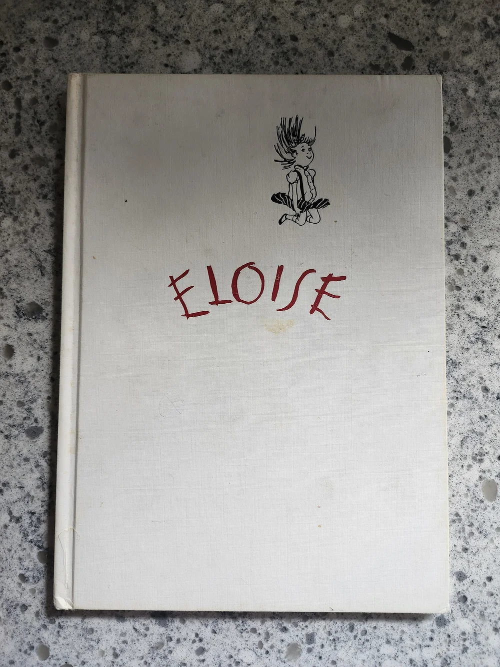 Eloise Hardcover Book - White Cover with Red Title